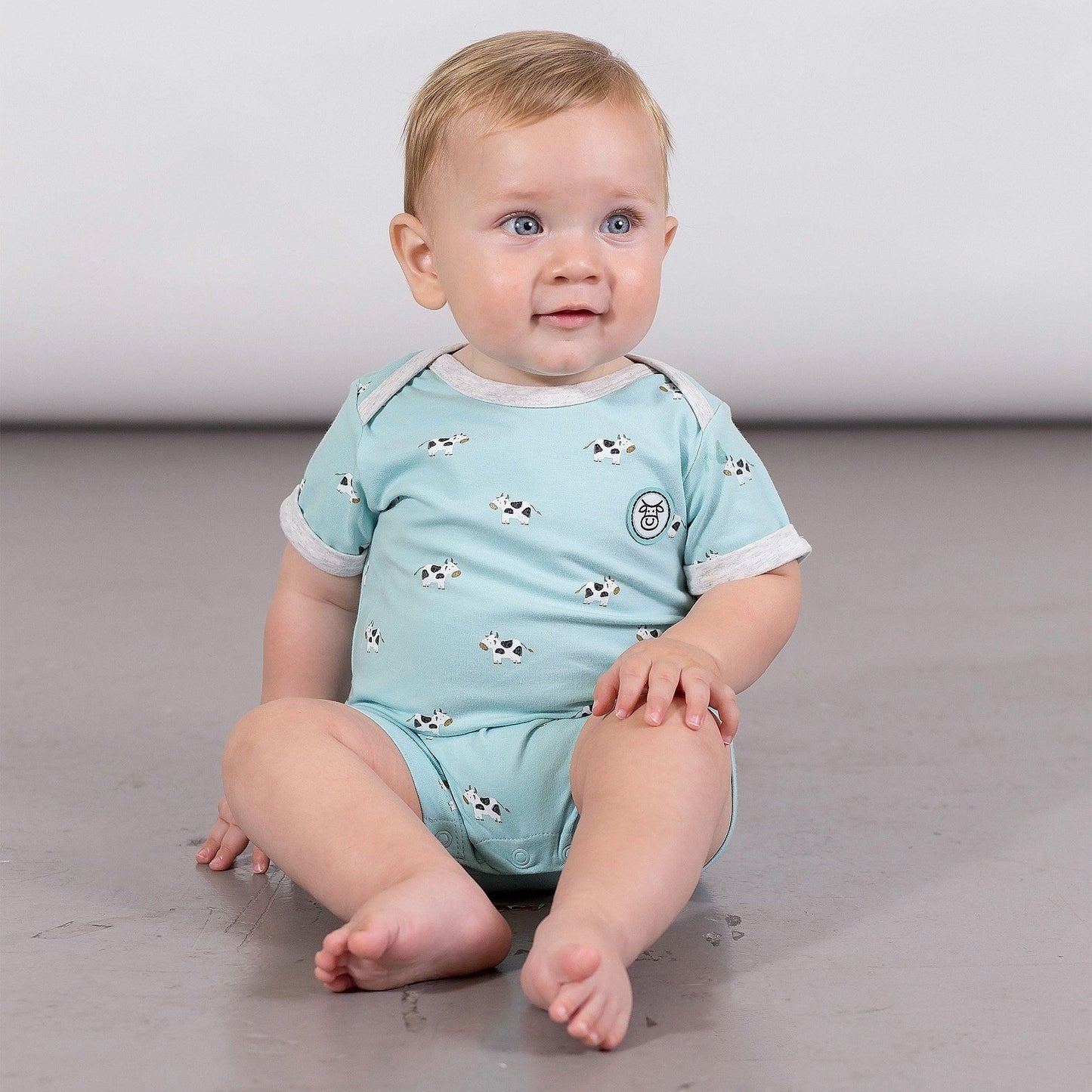 Organic Cotton Short Sleeve Turquoise Cow Print Romper